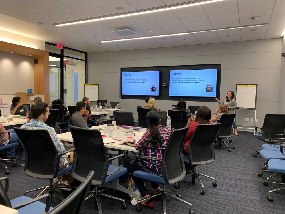 Workshop presentation with team members collaborating